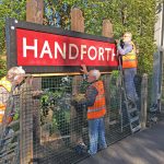 Members of FoHS mounting the new running in board on the three sleepers