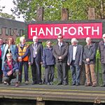 The unveiling ceremony (Nancy Connolly and her son Brian underneath the N and D respectively) The unveiling ceremony