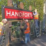 Members of FoHS mounting the new running in board on the three sleepers Members of FoHS mounting the new running in board on the three sleepers